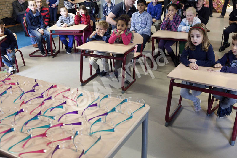 Ahmed Aboutaleb, mayor of Rotterdam, (not pictured) presents the first firework glasses to children at an elementary school in Rotterdam, The Netherlands, 10 December 2012. Some 53,000 children of Rotterdam will receive free firework glasses. Relatively many children suffer eye injuries during the lighting of fireworks.  EPA/ARIE KIEVIT