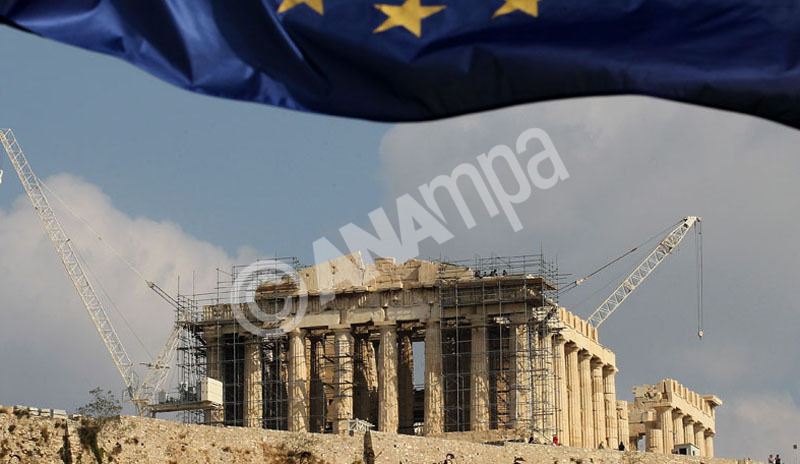A European Union flag waves accross the Parthenon of Acropolis in Athens, Greece on 03 November 2011.   EPA/ORESTIS PANAGIOTOU